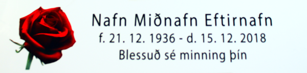 Hvítt skilti með svörtu letri og mynd